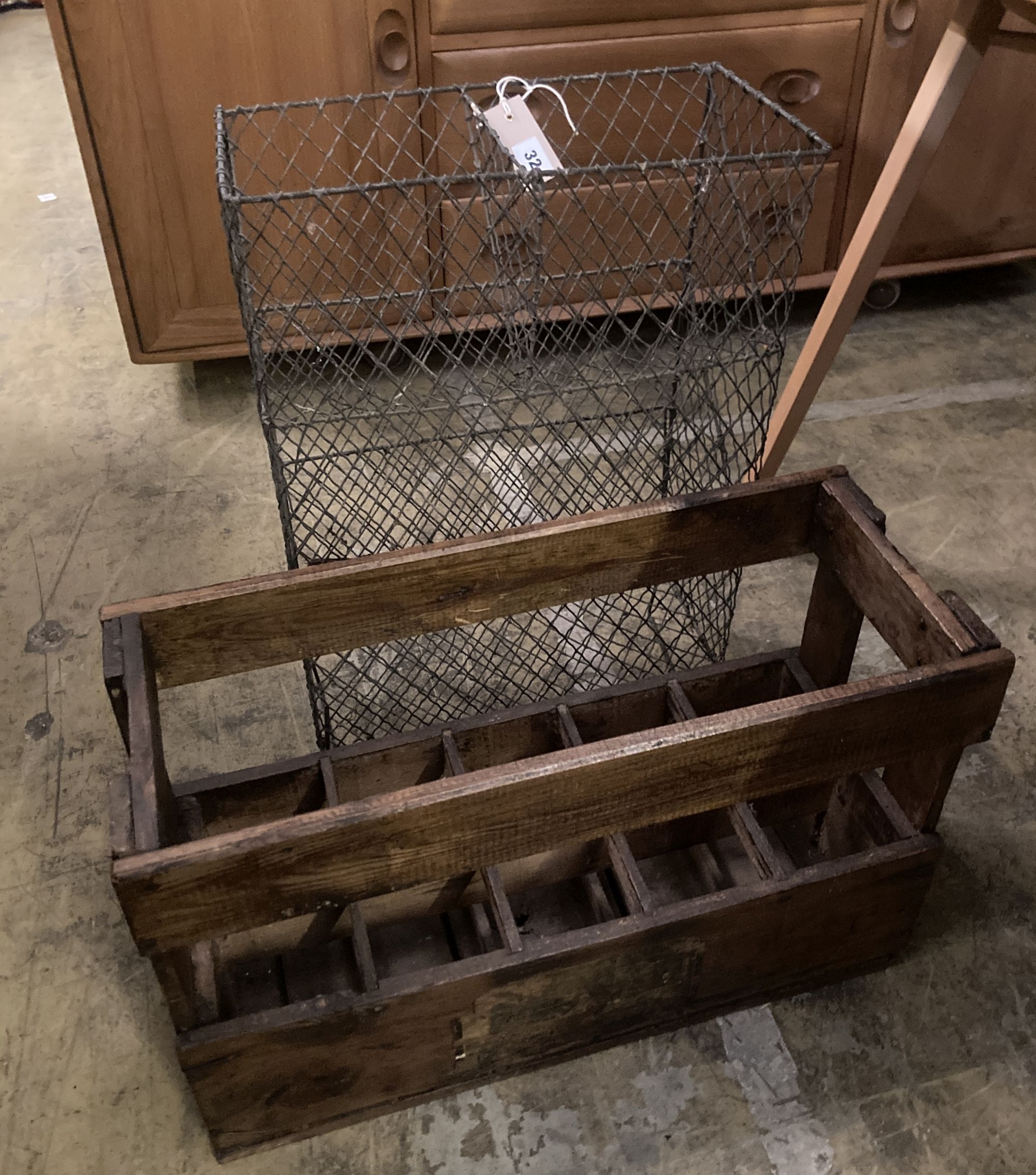 A vintage wood ten division bottle carrier, width 58cm depth 24cm height 37cm, together with a wirework rack